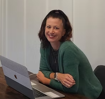 Woman smiling at computer